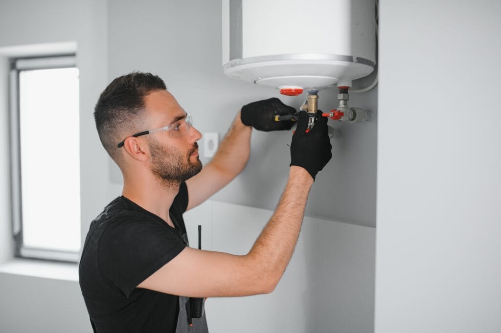 Technician performing water heater maintenance in Fort Lauderdale